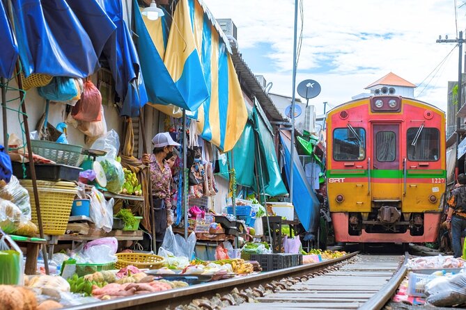 Amphawa Floating Market & Maeklong Railway Train Market Tour - Maeklong Railway Market: watching the market make room for the train