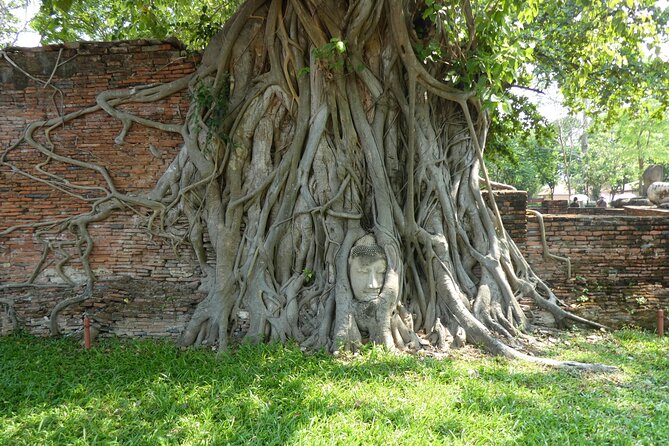 Ayutthaya Famous Temple & Scenic Boat Tour From Train Station - Wat Yai Chai Mongkhon: chedi scale, reclining Buddha, and saffron rows