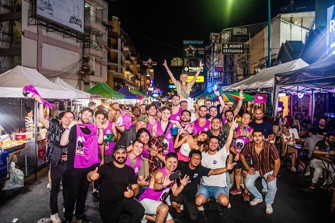 Bangkok After Dark: Pub Crawl Adventure - Stop 3: Juicy (Live Music) with games, dancing, and a social crowd