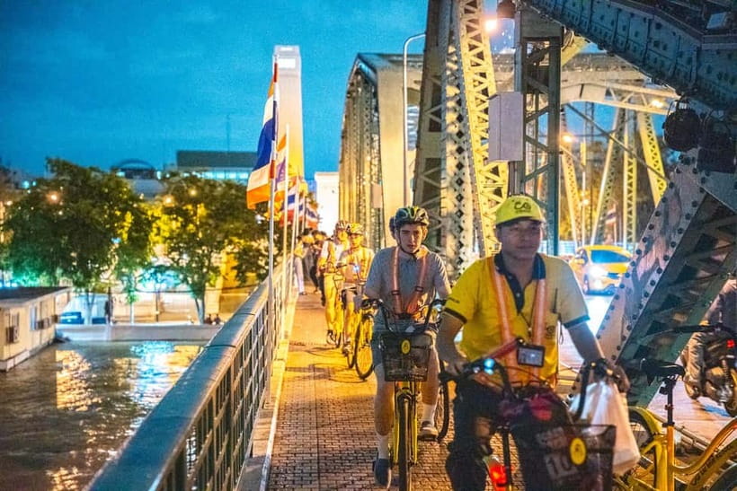 Bangkok by Night Cycling Tour with Street-food Meal - Chinatown at night: lanterns, shop signs, and the street-life switch