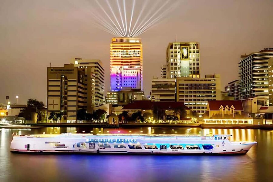 Bangkok: Carnival Dinner Cruise with Free-Flow Beer & Buffet - Chao Phraya skyline moments: Rama VIII Bridge, Wat Arun, ICONSIAM, and Asiatique