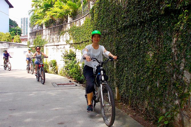 Bangkok Green Oasis 4-Hour Bike Tour with Boat Ride - The park and botanical garden stop: shade, fish, and a calmer pace