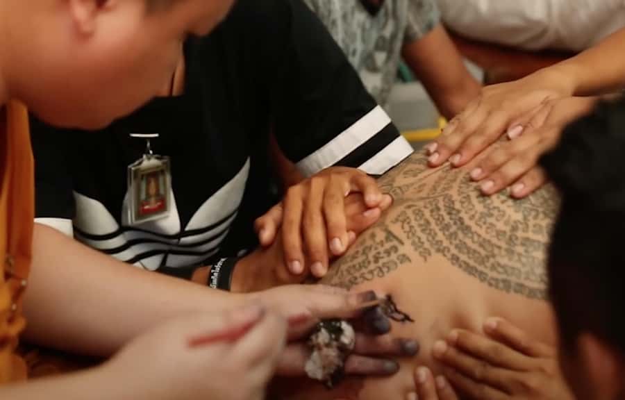 Bangkok: Hand-Poke Tattoo Guide at Wat Bang Phra & Blessing - Na Naa Thong (Golden Face) blessing: prosperity in gold leaf