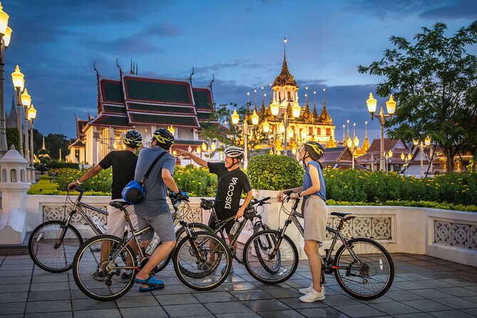 Bangkok: Night Bike Tour with Temples & Flower Market Visit - Thonburi side: Wat Rakang and the riverside rhythm