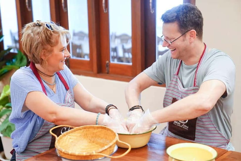 Bangkok: White Lotus Thai Cooking Class with Market Tour - Eating Together, Choosing Spice, and Folding the White Lotus