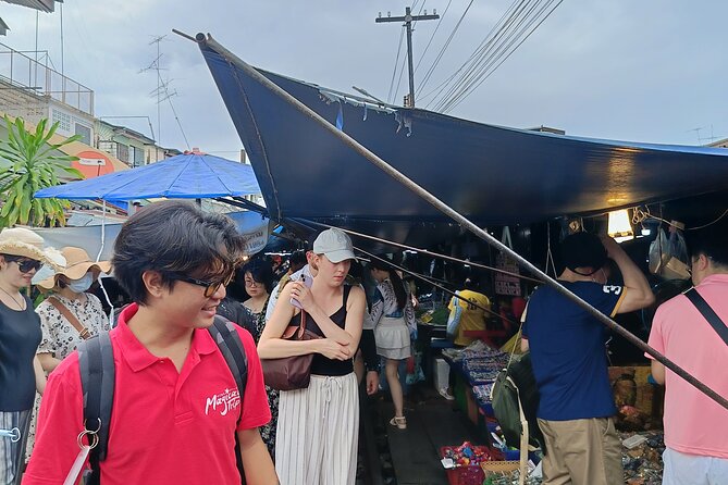 Damnoen Saduak and Maeklong Railway Market Tour with Private Car - Damnoen Saduak by paddle boat: the canals do the talking