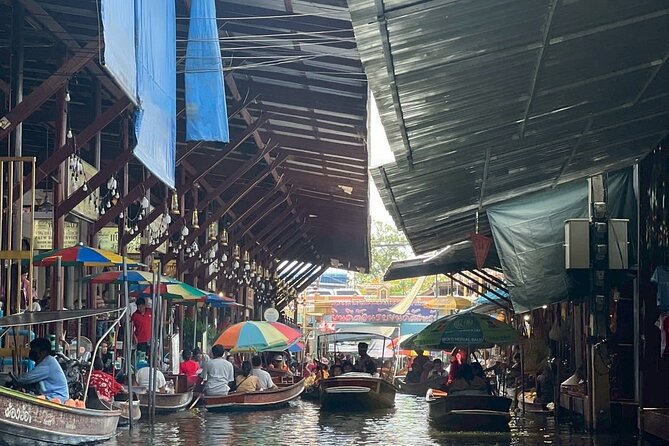 Damnoen Saduak and Maeklong Railway Market Tour with Private Car - Maeklong Railway Market: watching the train stop the whole world