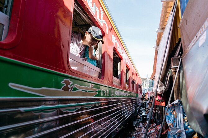 Damnoen Saduak Floating Market & Maeklong Train Market Tour - Transportation and comfort: air-conditioned rides with a couple of small caveats