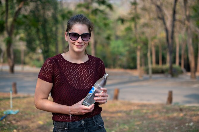 Erawan Waterfalls and Bridge Over River Kwai Tour from Bangkok - The seven-tier Erawan Waterfalls: hiking, swimming, and fish reality