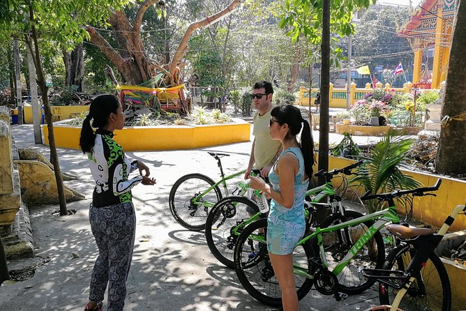 Explore Bangkok by Bike & Boat with Lunch - Wat Ko (Rooster Temple): feeding fish and a side of humor