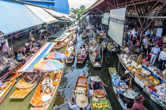 Famous Markets Tour: Maeklong Railway & Damnoen Saduak Floating - Maeklong Railway Market: Umbrellas Down When the Train Comes Through