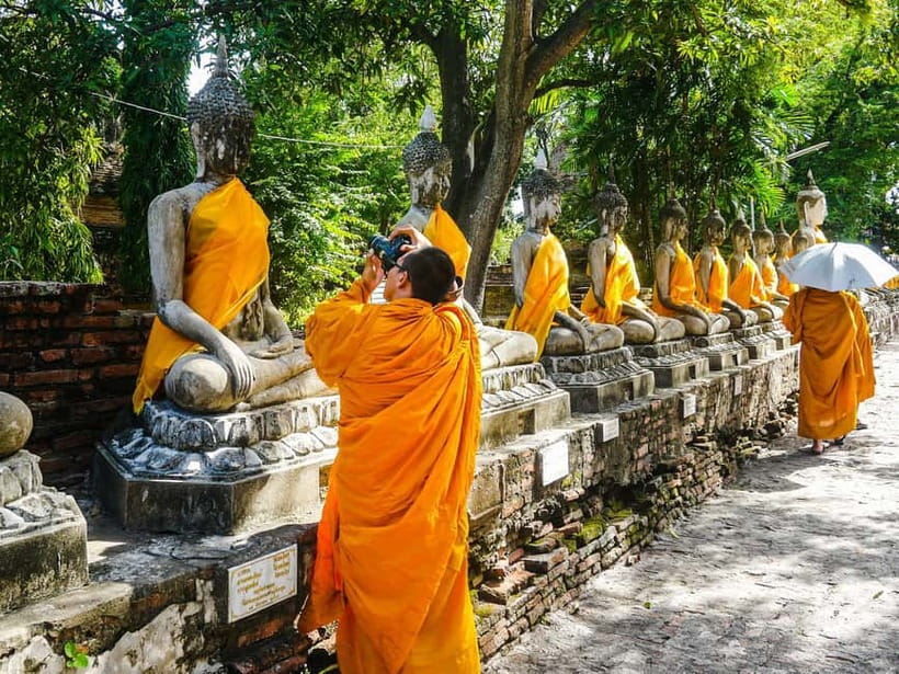 From Bangkok: Ayutthaya Heritage Tour with Sunset Boat Ride - Wat Maha That: the Buddha head trapped in tree roots