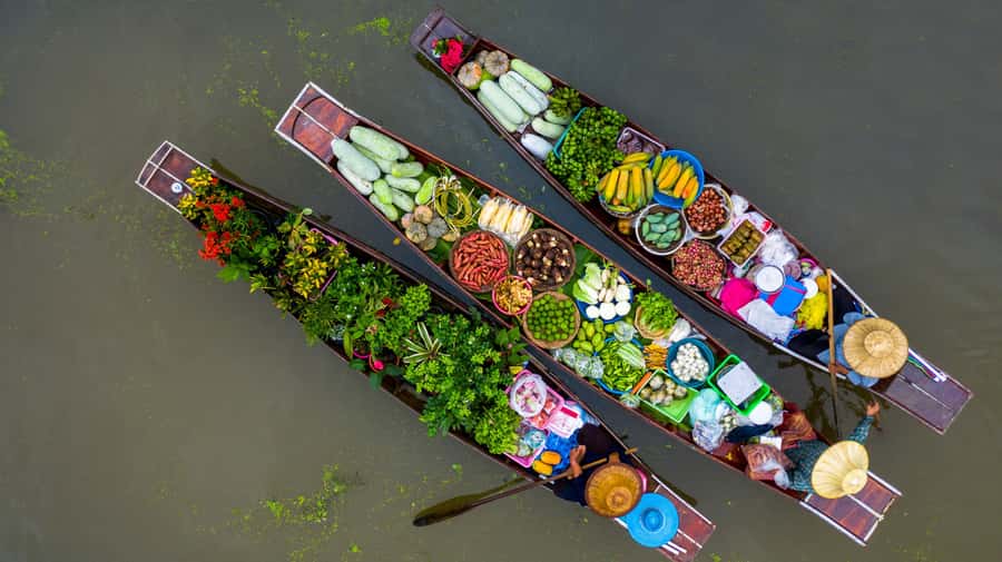 From Bangkok: Maeklong Railway and Floating Market Food Tour - Longtail boat canals: the calm between two market worlds
