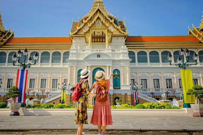 Grand Palace, Damnoen Floating Market & Maeklong Railway Market Tour – Full Day - Damnoen Saduak Floating Market: canals, boats, and buying the feeling
