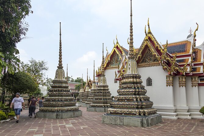 Half-Day Royal Grand Palace and Bangkok Temples Tour - Wat Pho: Reclining Buddha, Gold Leaf Details, and Temple Age