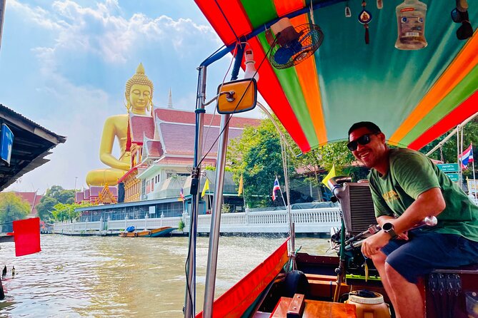Hidden Bangkok Longtail Boat Tour to Big Buddha&Canal Life 2hrs - Cruising past Wat Paknam Big Buddha: the view from the water