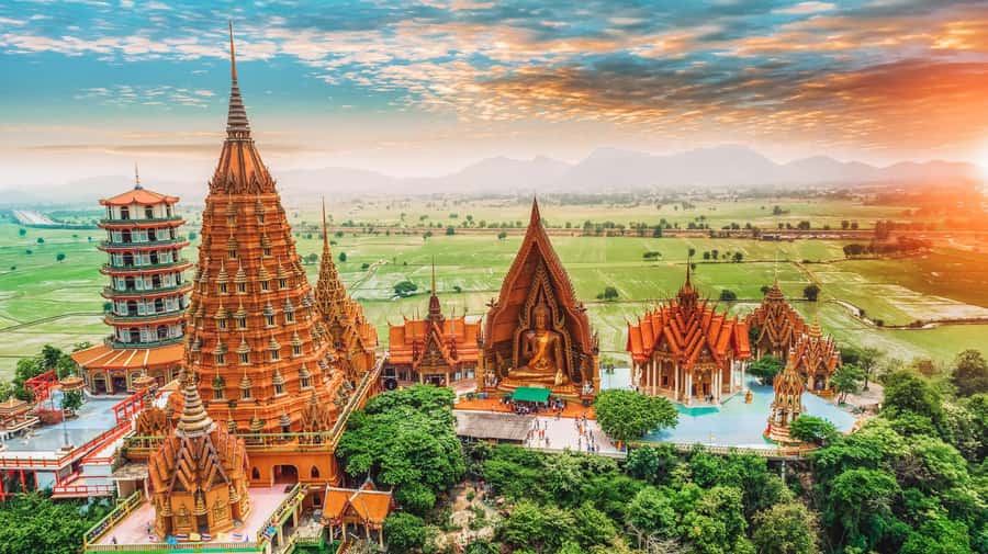 Kanchanaburi: River Kwai and Death Railway Day Tour - Wat Tham Suea (Tiger Cave Temple): tiger paw prints, an 18-meter Buddha, and the steep climb