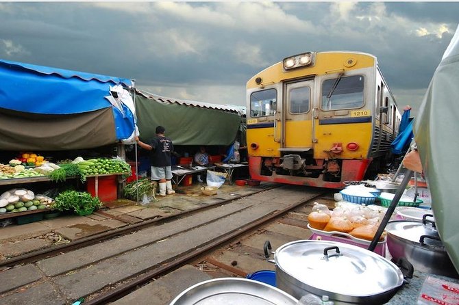 Maeklong & Damnoen Saduak Markets: Railway & Floating Market Tour - Damnoen Saduak floating market: loud, colorful, and tourist-famous for a reason
