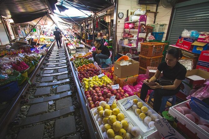 Maeklong Railway Market and Damnoen Saduak Floating Market Tour From Bangkok - Damnoen Saduak Floating Market: long-tail boats and canal food