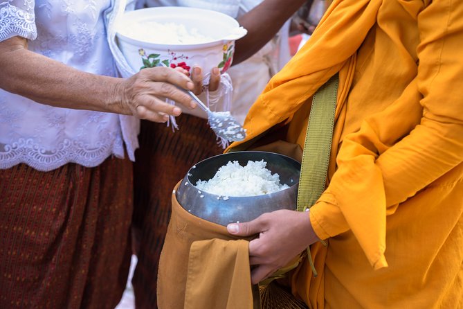 Morning Buddhist Almsgiving, Grand Palace and Flower Market Tour in Bangkok - Buddhist almsgiving at a Bangkok monastery: what you’re really doing