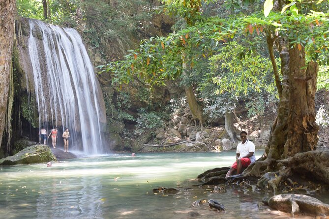 Private 2 Day Tour to Erawan Waterfall and Highlights of Kanchanaburi - Mae Klong Railway Market: the train moment plus simple local snacks