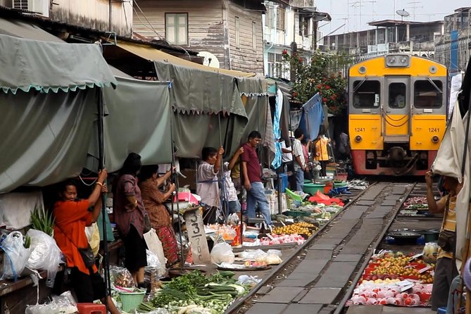 Private Damnoen Saduak Floating Market and Train Market Tour - Maeklong Railway Market: the moment the train changes everything
