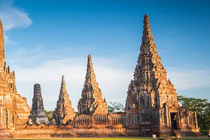 Sunset Sail, Glittering Tempels at Afternoon Ayutthaya Tours - Wat Chaiwatthanaram: praying in traditional dress