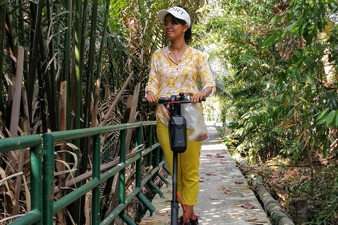 Take a E-Scooter Ride in Bangkok's Jungle - Start at Wat Khlong Toei Nok Pier, then switch from city to canals