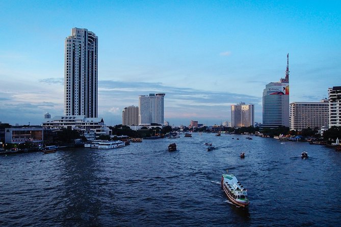 The White Orchid River Dinner Cruise Experience - Cruising past Bangkok icons: Grand Palace area, Wat Arun, and more