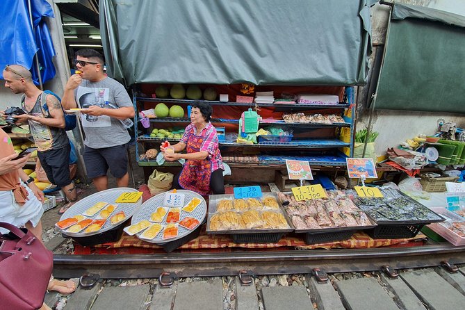 Train & Floating Market Food Adventure + Scenic train ride - Guides make the difference: Johnny, Aom, Om, and Wes